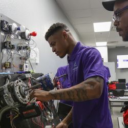 NCC HVAC Students working on electrical wiring and motor components at an HVAC school in Las Vegas.