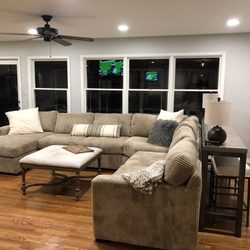 Southern Loft - My favorite room in the house- sectional, pillows, ottoman and console table with stools all from Southern Loft