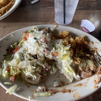El Mariachi Mexican Restaurant - A burrito with queso; the picture is halfway through the meal cause I just couldn't wait! - Mexican Near Me - Nashville, Tennessee