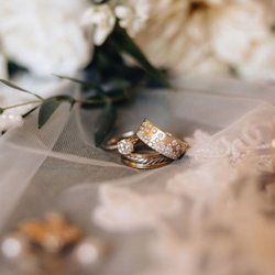 Molina Fine Jewelers - Actual photo of my engagement ring and wedding bands (taken on my wedding day).