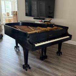 Calloway Moving and Storage - Baby grand getting prepped for transport
