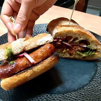 Lechon - Happy Hour Choripan is a good size very filling sandwich of smoked chorizo, chimichurri, pickled red onion, tomato relish $8 4* - Tapas Bars Near Me - Portland, Oregon Lechon - Happy Hour Choripan is a good size very filling sandwich of smoked chorizo, chimichurri, pickled red onion, tomato relish $8 4* - Tapas Bars Near Me - Portland, Oregon