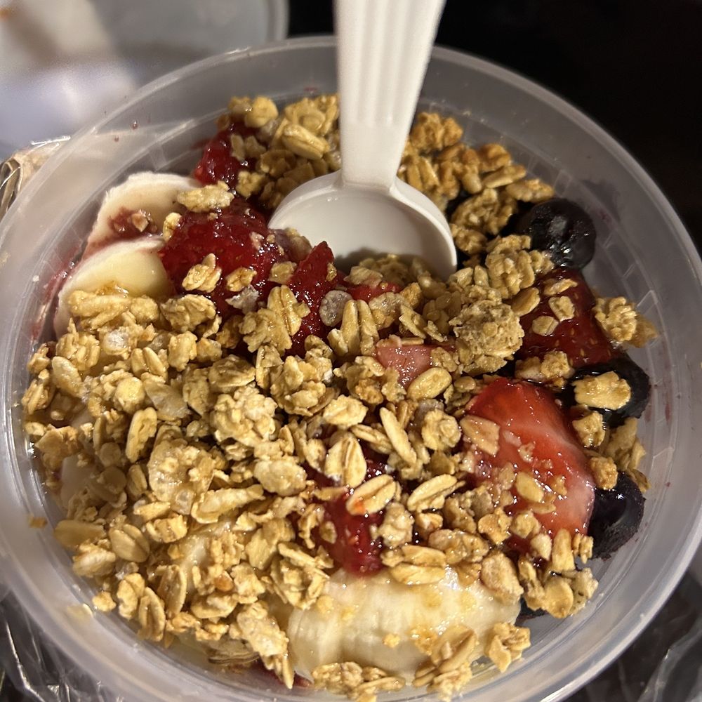 Acai bowl with almond butter and drizzled honey Acai bowl with almond butter and drizzled honey