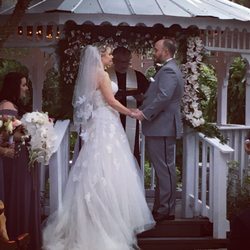 Downtown Flowers - Orchid bouquet and sweet draping garland on the gazebo!