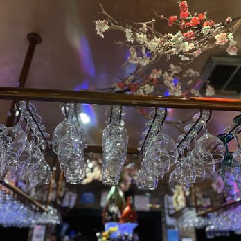 Encore - a bunch of wine glasses hanging from the ceiling - New American Near Me - Brooklyn, New York Encore - a bunch of wine glasses hanging from the ceiling - New American Near Me - Brooklyn, New York
