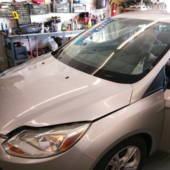 Windshield Express - Removing the cracked glass in the shop - Auto Glass Services Near Me - Covina, California