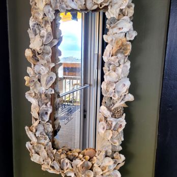 The Deadrise - Ambiance. I liked the shell mirror in the lobby at the top of the stairs. - Seafood Near Me - Fort Monroe, Virginia The Deadrise - Ambiance. I liked the shell mirror in the lobby at the top of the stairs. - Seafood Near Me - Fort Monroe, Virginia