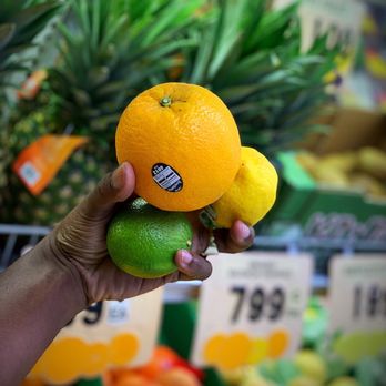 King's Red & White Super Market - a hand holding two oranges - Grocery Near Me - Durham, North Carolina King's Red & White Super Market - a hand holding two oranges - Grocery Near Me - Durham, North Carolina