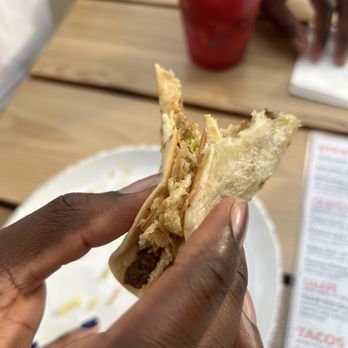 Texan Taco Bar - half eaten taco - Tacos Near Me - Chicago, Illinois Texan Taco Bar - half eaten taco - Tacos Near Me - Chicago, Illinois