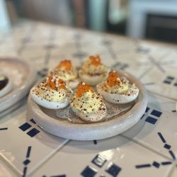 Frank & Laurie's - Deviled eggs with smoked trout roe