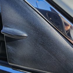 Trim damaged with white substance from soapy noble east lyme car wash.It doesn't come off