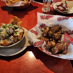 St. Louis Bar & Grill - Spicy Garlic Parm Wings with St Louis Poutine