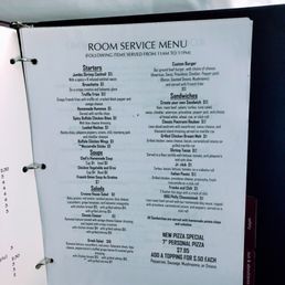 outdated menu in room binder with food that they no longer have on it
