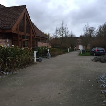 In de Vrede - Cafe on the left and monastery in the distance. Walk time between the two is maybe 2 minutes. - Cafes Near Me - Westvleteren, VWV