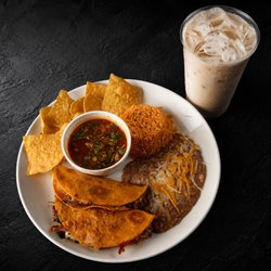 Fuego Cravings - Two cheesy, flavorful quesabirrias served with fluffy rice,  beans, a side of rich consommé for dipping, crispy chips, and a med. drink.