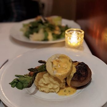 Ciera Steak + Chophouse - Bacon wrapped filet mignon topped with king crab filled artichoke + charone sauce. Served with garlic mash and asparagus. - Steakhouses Near Me - Stateline, Nevada