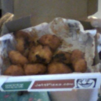 Jet's Pizza - If I wanted it burnt I'd have burned it myself!  The ones that look edible are actually artfully placed so you don't see it at first. - Pizza Near Me - Adrian, Michigan