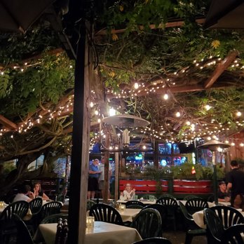 Bella Union - Patio canopied by huge wisteria vine - Italian Near Me - Jacksonville, Oregon