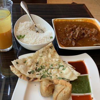 India Oven Eldorado Hills - June 1, 2023: India Oven's Punjabi goat curry, rice, lamb samosa, and mango lassi. - Indian Near Me - El Dorado Hills, California India Oven Eldorado Hills - June 1, 2023: India Oven's Punjabi goat curry, rice, lamb samosa, and mango lassi. - Indian Near Me - El Dorado Hills, California