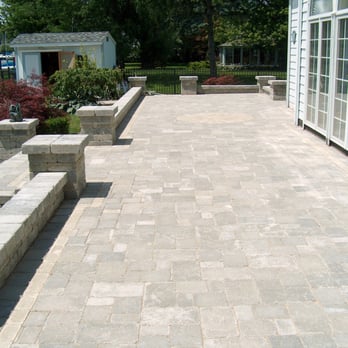 Todaro's Landscaping - a patio with a brick wall - General Contractors Near Me - Chesterfield, Michigan Todaro's Landscaping - a patio with a brick wall - General Contractors Near Me - Chesterfield, Michigan