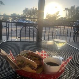 Pastrami sandwich with a pickle and side of aju for dipping  #8and small glass of wine