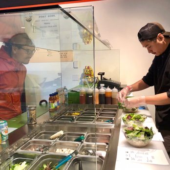 Dal's Poke - a man preparing a salad - Poke Near Me - Langley, British Columbia Dal's Poke - a man preparing a salad - Poke Near Me - Langley, British Columbia