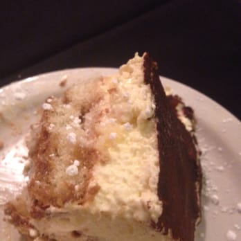 Villa Capri - You cannot leave this place without Tiramisu! Some of the best you'll ever have. Only a 1/2 piece shown, 2 many bites taken - Italian Near Me - Altoona, Pennsylvania Villa Capri - You cannot leave this place without Tiramisu! Some of the best you'll ever have. Only a 1/2 piece shown, 2 many bites taken - Italian Near Me - Altoona, Pennsylvania