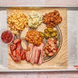 Chow Camp - The Pit Boss Sampler gives you 3 meats, and plenty of sides.