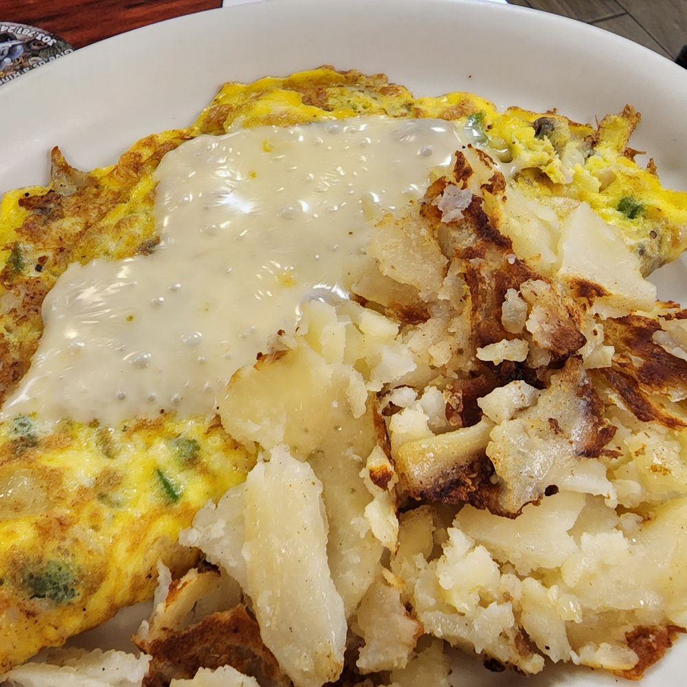 Mike's Cafe - an omelet with potatoes and gravy - American Near Me - Englewood, Colorado Mike's Cafe - an omelet with potatoes and gravy - American Near Me - Englewood, Colorado