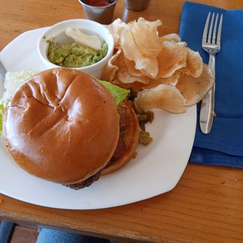 La Fonda Del Bosque - Green chili cheeseburger with crispy bacon, house made fries and guacamole - Latin American Near Me - Albuquerque, New Mexico La Fonda Del Bosque - Green chili cheeseburger with crispy bacon, house made fries and guacamole - Latin American Near Me - Albuquerque, New Mexico