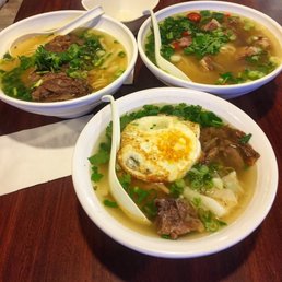 three bowls of soup on a table