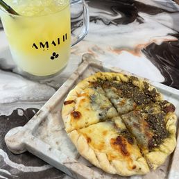 Pineapple lemonade and zatar flatbread with cheese. Pineapple lemonade and zatar flatbread with cheese.