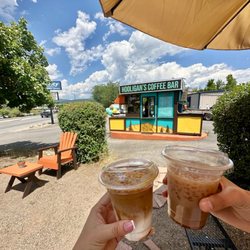 Hooligans Coffee Bar - Shaded patio seating, dog beds, and water bowls