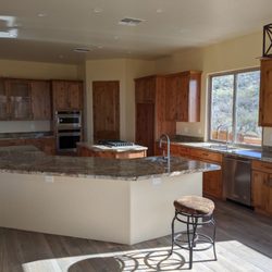 Dalecke Carpentry - Rustic alder, shaker style kitchen cabinets