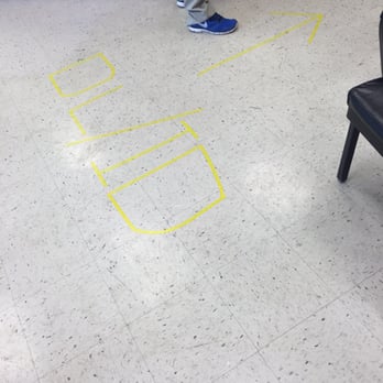 BMV - Ratty tape signs on the floor. - Departments of Motor Vehicles Near Me - Columbus, Ohio
