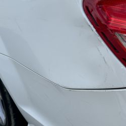 Jays dent repair - Dent left from another vehicle that backed into my rear end bumper.