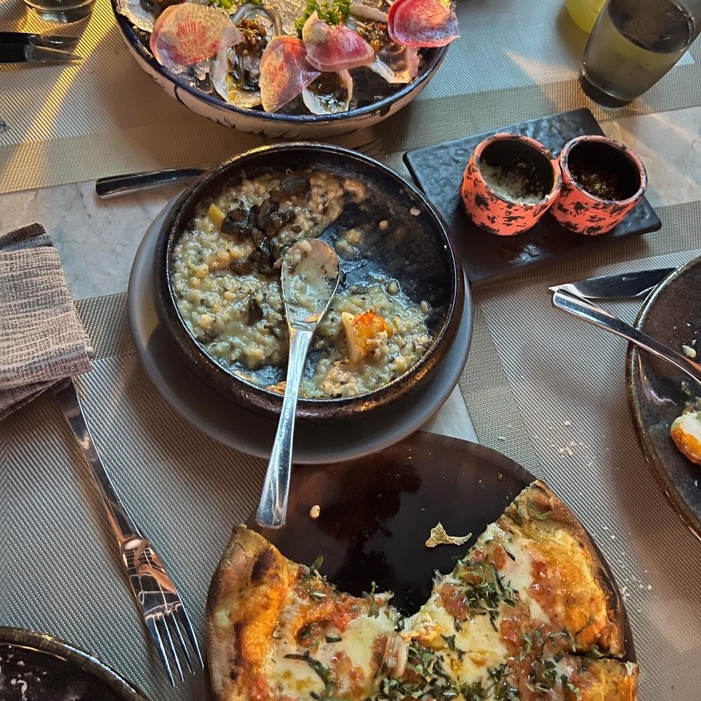 Oysters, creamy rice with lobster, margharita pizza