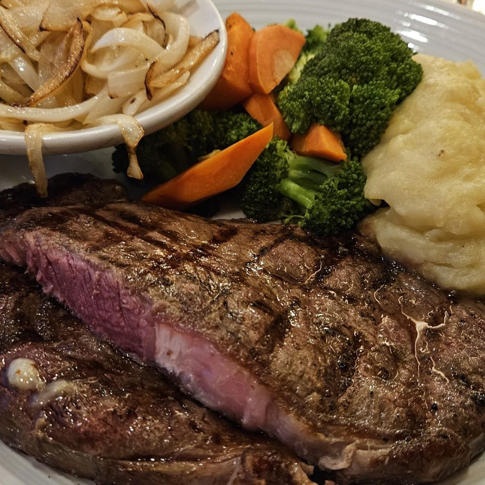 Georgie's Beachside Grill - Ribeye Steak, medium, w/side of sautéed onions - American Near Me - Newport, Oregon Georgie's Beachside Grill - Ribeye Steak, medium, w/side of sautéed onions - American Near Me - Newport, Oregon