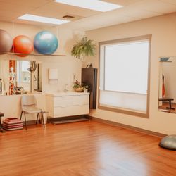 Mend Bodyworks - Stretching area of our rehab gym, along with TRX. Pull up bar and balance bar are to the left out of the frame