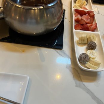 The Melting Pot - Vegan chocolate with fruit and some kind of vegan coconut ball - Fondue Near Me - Pittsburgh, Pennsylvania The Melting Pot - Vegan chocolate with fruit and some kind of vegan coconut ball - Fondue Near Me - Pittsburgh, Pennsylvania