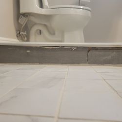 Missed cracked tile, directly stuck on wood. no insulation. How does an inspector miss that?