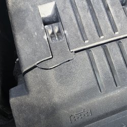 Jiffy Lube - Better view of the damage Jiffy Lube techs cr e ate for you when they dont close the air filter box before shutting the hood of your car