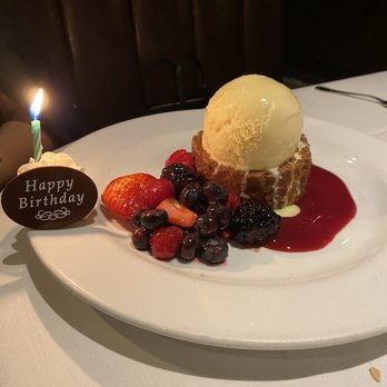 Ocean Prime - Warm Butter Cake with Vanilla Ice Cream, Berries, and Raspberry sauce - Seafood Near Me - Boston, Massachusetts