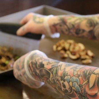 Pita Pit - a tattooed person preparing food - Sandwiches Near Me - Butte, Montana Pita Pit - a tattooed person preparing food - Sandwiches Near Me - Butte, Montana