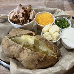 The Back Porch BBQ - Loaded baked potato with smoked turkey.