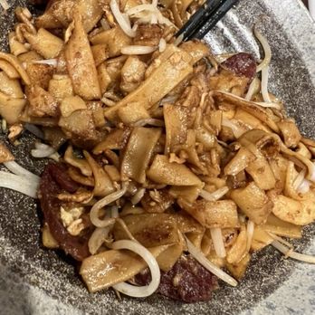 John 3:16 Malaysian Delights - CHAR KOAY TEOW - $15.95 CAD - Stir fried flat rice noodle with shrimp, egg, chives, bean sprouts, Chinese sausage and fish cakes. - Malaysian Near Me - Richmond, British Columbia