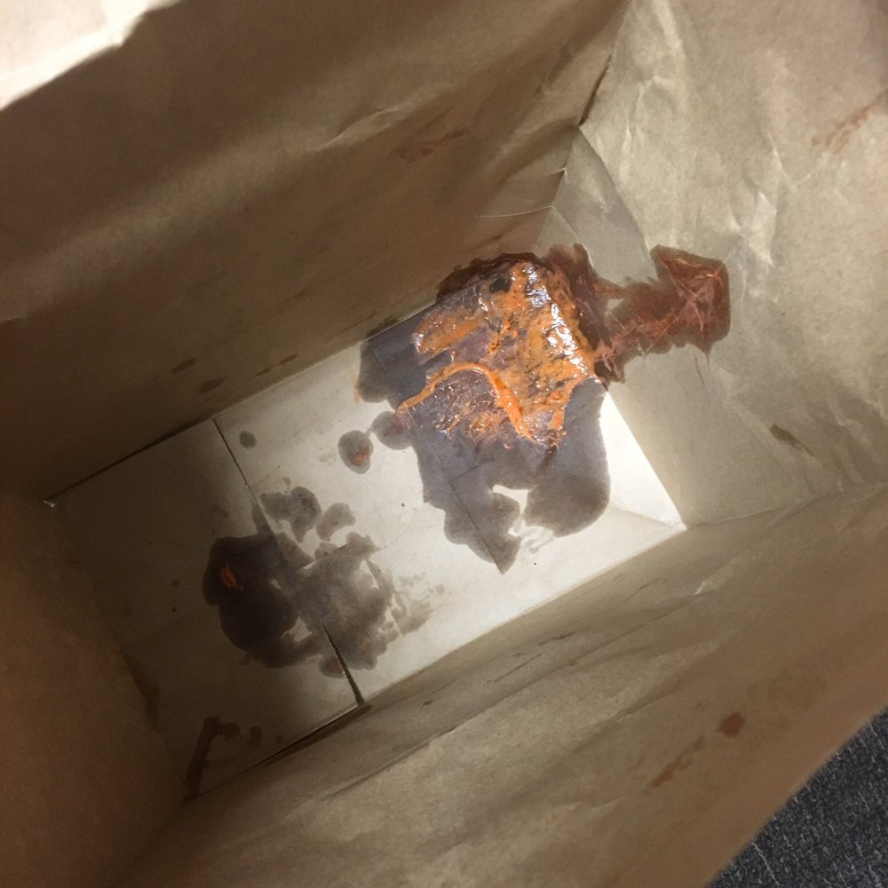 Wingstop - Grease and sauce completely soaked through the bottom and side of the bag. - Chicken Wings Near Me - Fontana, California
