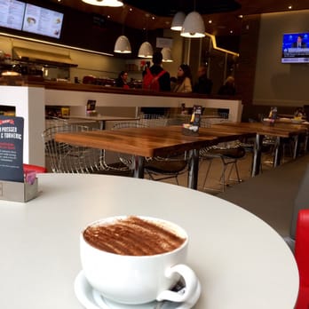 Aroma Espresso Bar - View of the place from near the door. More seating in the back. Love that there's comfortable seats instead of hard wooden chairs. - Coffee & Tea Near Me - Toronto, Ontario Aroma Espresso Bar - View of the place from near the door. More seating in the back. Love that there's comfortable seats instead of hard wooden chairs. - Coffee & Tea Near Me - Toronto, Ontario