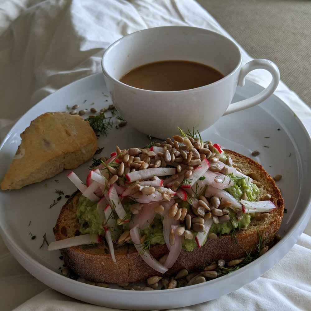 Avocado toast topped with sliced radish and pickled onion. And a scone. All delicious and filling. Avocado toast topped with sliced radish and pickled onion. And a scone. All delicious and filling.
