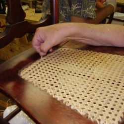 The Cane Connection - A student at work finishing a hand-cane chair seat during our thursday evening class